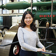 Female student in a machine hall