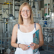 Female student standing in a chemistry lab