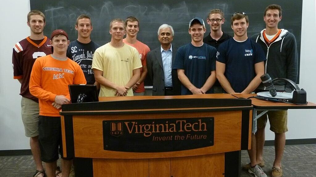 Group of students with professor in a classroom